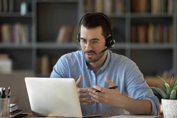 Man with headset providing small business IT services