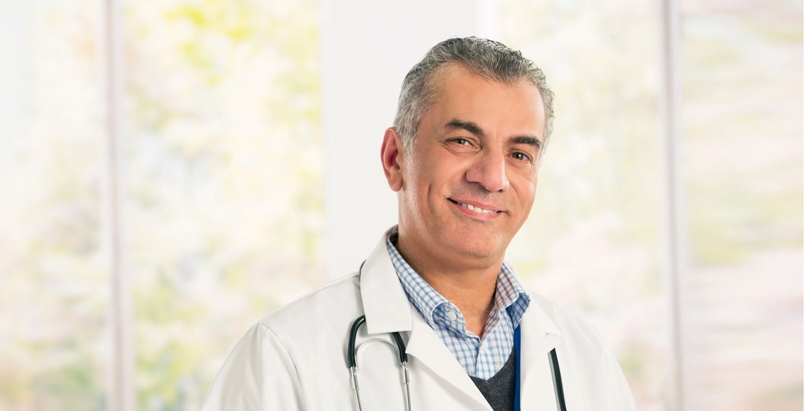 Smiling doctor in a white coat