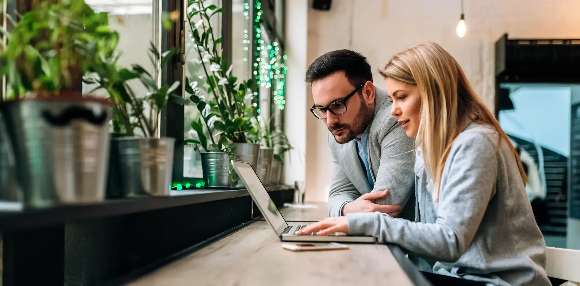 A managed IT service provider collaborating with a small business owner.